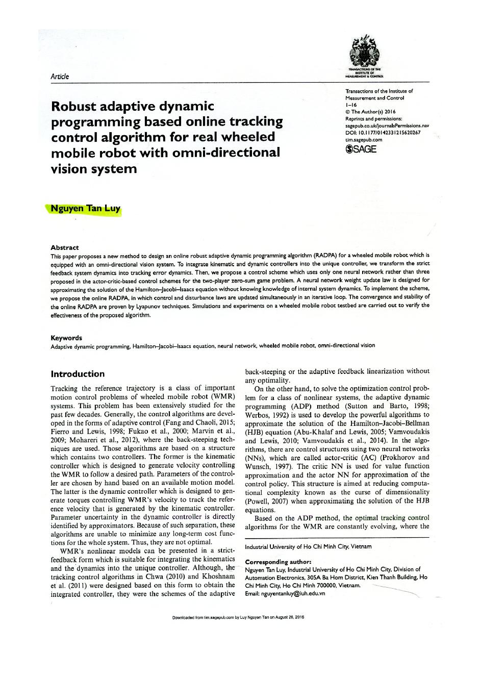 Robust adaptive dynamic programming based online tracking control algorithm for real wheeled mobile robot with ommi-directional vision system